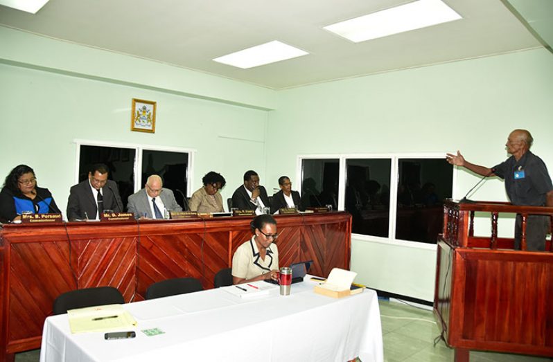Senior citizen, Zeenadeen Jameer, makes his case to the Land Commission of Inquiry (Adrian Narine photo)