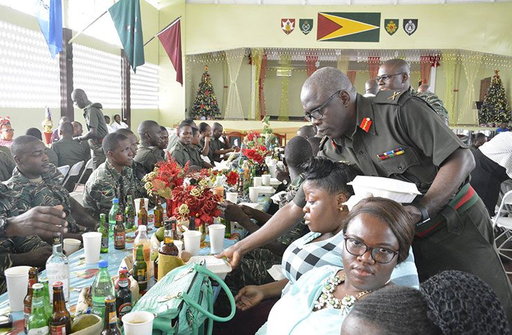 Chief of Staff Brigadier Patrick West at Base Camp Ayanganna assisted with sharing meals at the traditional Christmas Luncheon.