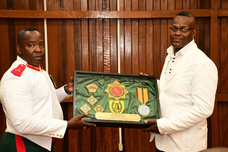 Chief-of-Staff (ag), Brigadier Godfrey Bess (left) presenting Brigadier (Ret’d) Gary Beaton with a token of appreciation for his long and dedicated service to the GDF