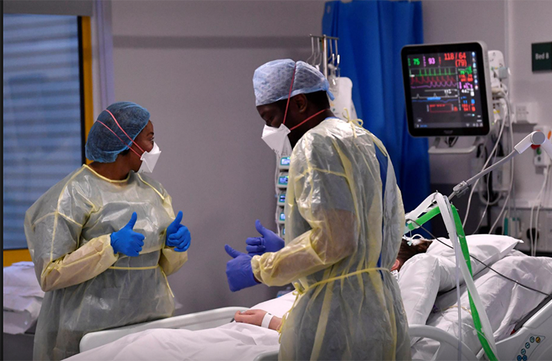 Nurses react as they treat a COVID-19 patient in the ICU at Milton Keynes University Hospital, amid the spread of the coronavirus disease (COVID-19) pandemic (Reuters/Toby Melville photo)