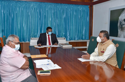 President Dr. Mohamed Irfaan Ali, High Commissioner of India to Guyana, Dr. K.J Srinivasa, and Tarchand Balgobin from the Ministry of Finance in discussion at State House on Friday (DPI photo)President of the Cooperative Republic of Guyana, His Excellency, Dr. Mohamed Irfaan Ali, High Commissioner of India to Guyana, H.E. Dr. K.J Srinivasa, and Mr. T. Balgobin from the Ministry of Finance, in discussion at State House.