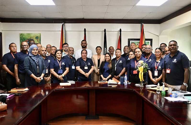 Minister of Home Affairs, Oneidge Walrond (centre), flanked by CPG officials along with Permanent Secretary of the Ministry, Mr. Andre Ally and Deputy Permanent Secretary, Mr. Dwayne Adams