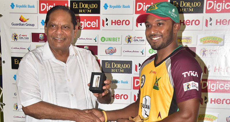 Veerasammy Permaul collects the Man-of-the-Match award from Prime Minister Moses Nagamootoo (Adrian Narine photos)