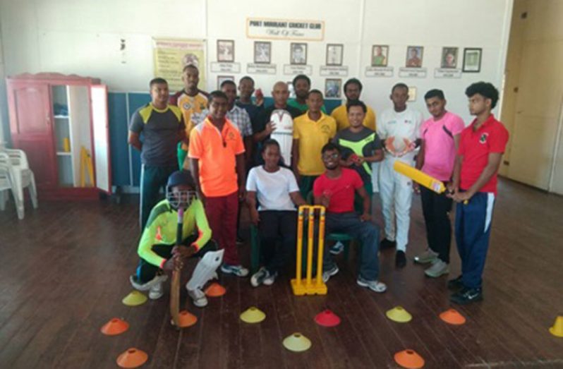 Participants with coach Latchman Yadram (in orange shirt, standing left)