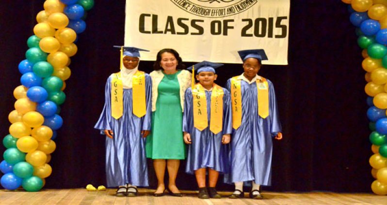 First Lady, Mrs. Sandra Granger with three of the school’s top performing students this year at the NGSA examinations. They are, from left, Afeeah London, Solomon Cherai, and Shania Eastman. The occasion was the school’s Fifth Annual Graduation Ceremony held yesterday at the National Cultural Centre (Photo by Adrian Narine)
