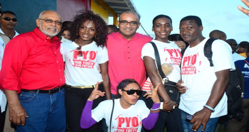 Head of State, Donald Ramotar along with his predecessor Bharrat Jagdeo with members of the PYO at Babu John on Sunday last