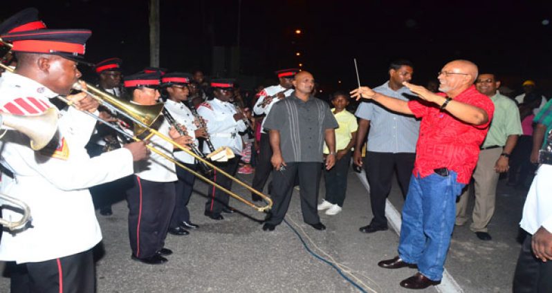 President Donald Ramotar tries his hand at conducting the Guyana Police Band