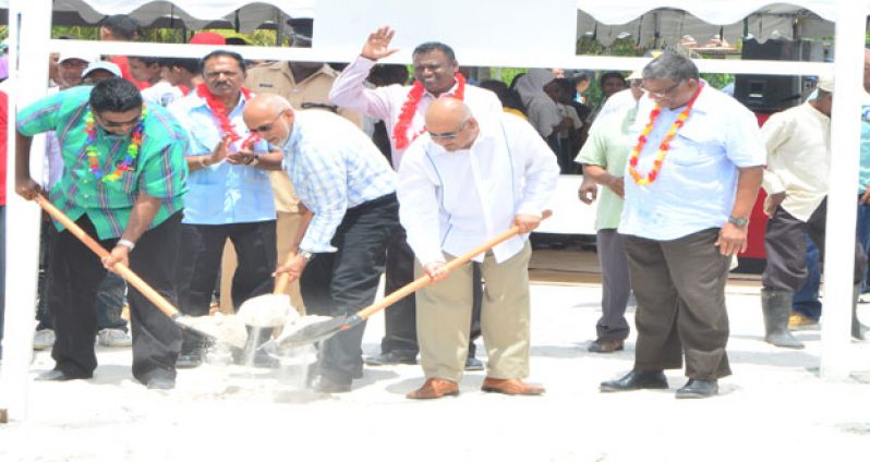 ‘GROUND-BREAKING’: President Donald Ramotar, Minister Irfaan Ali and Dr. Suresh Narine turn the sod at the site where the multi-million-dollar Rice Cereal Manufacturing Facility at Anna Regina will be built. Looking on, in this Adrian Narine photo, are Labour Minister, Dr. Nanda Gopaul (right), Minister within the Ministry of Agriculture, Mr. Ali Baksh and Region Two Chairman, Mr. Parmanand Persaud