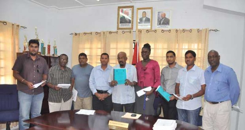 “From left to right, Representative from STP Investment; contractor Ivor Allen; contractor Hemraj Gharbaran; Permanent Secretary of the Local Government Ministry, Mr. Collin Croal; Minister of Local Government and Regional Development, Mr. Norman Whittaker; Deputy Permanent Secretary of the Local Government Ministry, Ms. Abena Moore; Representative from Netcom Computer City; Representative of S. Jagmohan Hardware Supplies & Construction Services; and Project Manager of the Clean Up Guyana project, Mr. Gordon Gilkes”