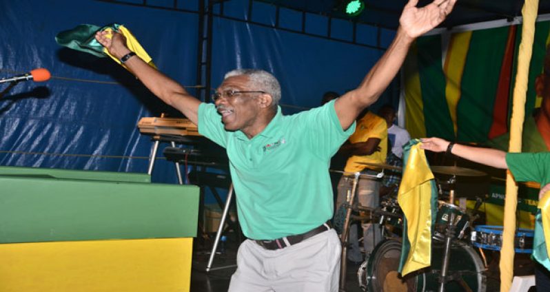 Presidential Candidate of the APNU+AFC coalition, David Granger gives a unity dance at the APNU+AFC unity rally yesterday   (Samuel Maughn photos)