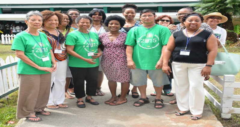 Some past St. Rose’s High students pose for a picture