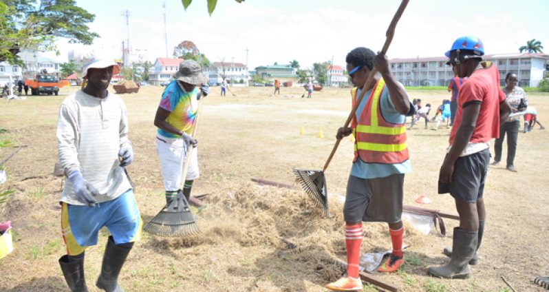 Labourers at work cleaning up Parade Grounds as part of the Green City Initiative.