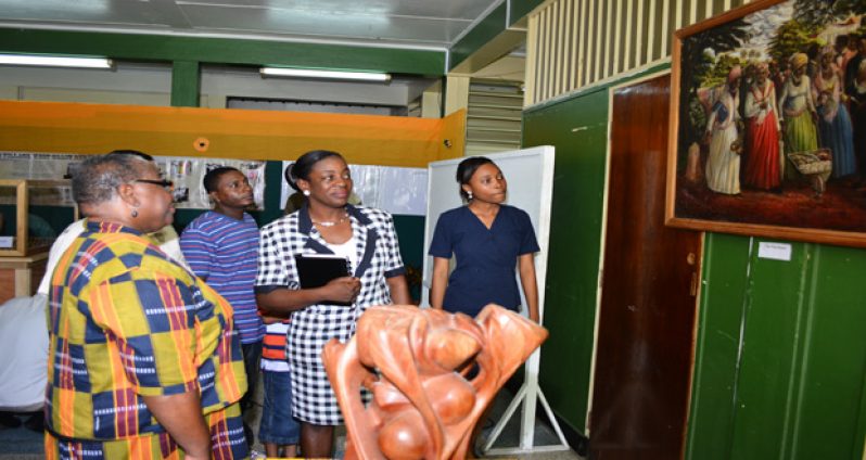 Minister within the Ministry of Education, Minister Nicolette Henry at the exhibition along with colleagues (Photos by Samuel Maughn )