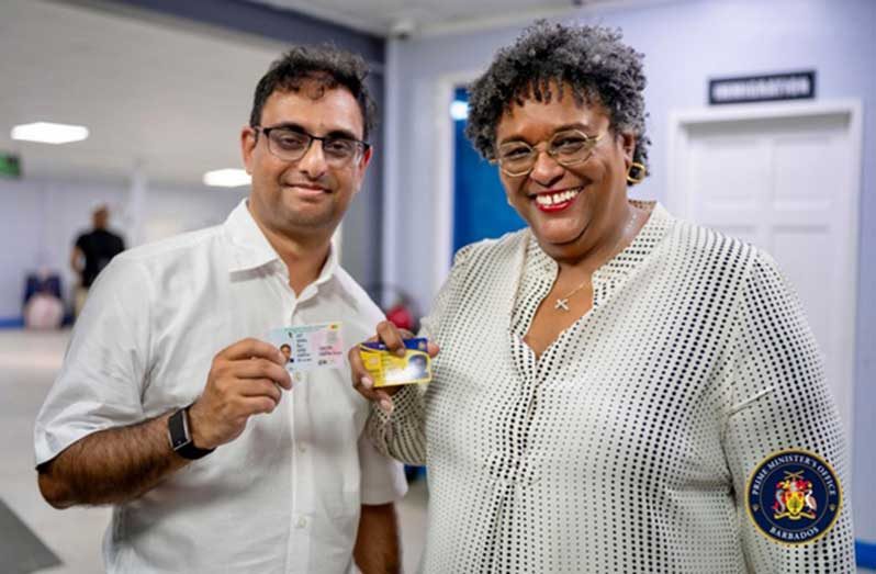 Prime Minister of Barbados, Mia Mottley and Minister of Public Service, Government Efficiency and Implementation, Zulfikar Ally, display their e-ID cards