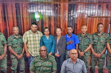 Officers from the Guyana People’s Militia posing with Regional Executive Officer, Denis Jaikarran and other regional officials in the boardroom of the Regional Democratic Council