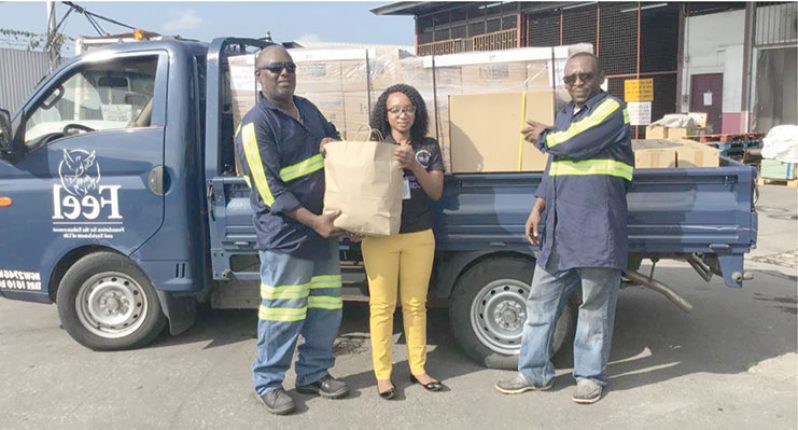 Nadine Jardine, Caribbean Airlines Cargo Operations Manager POS & Southern Caribbean receives donated relief supplies from Kevin Williams and Christian George of The Foundation for the Enhancement and Enrichment of Life (FEEL). The donated supplies will be airlifted to Nassau, Bahamas via Caribbean Airlines scheduled service on Sunday September 8