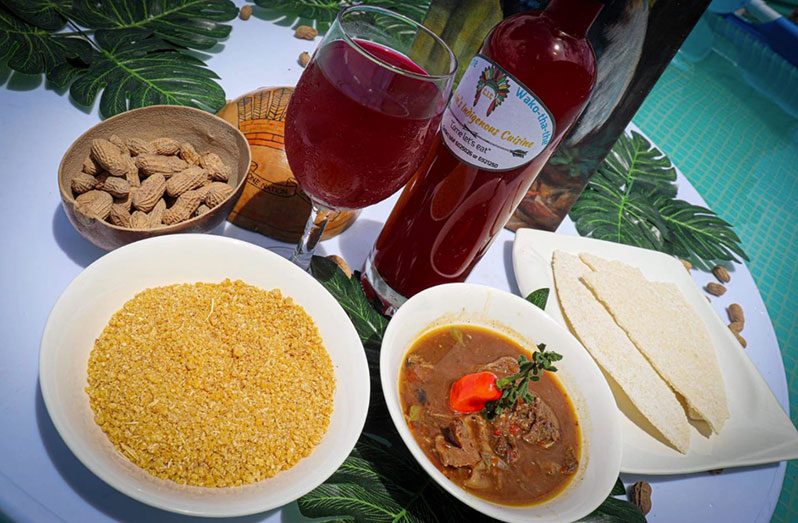 Deer tuma with cassava bread, farine and the "Mighty Fly" drink