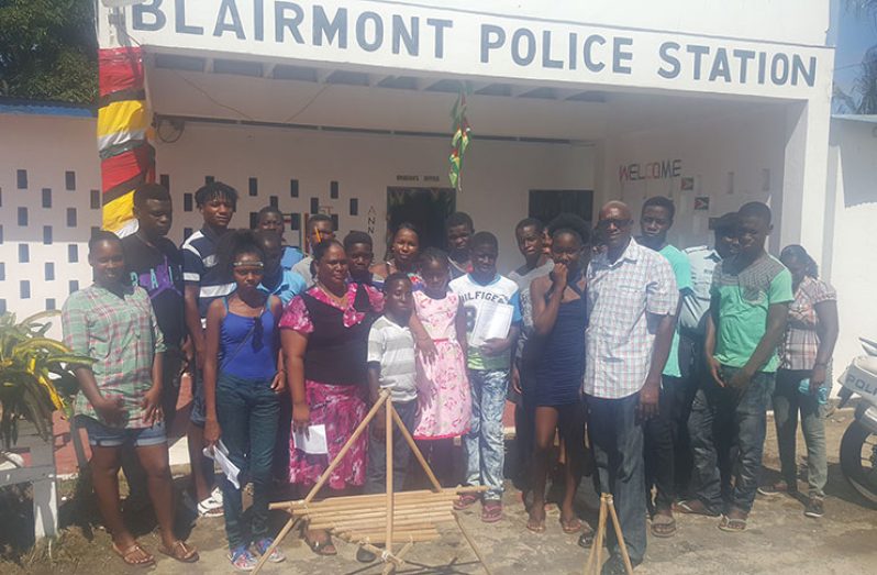 Members of the youth group with Inspector C Kelly (third from left) and Assistant Superintendent of Police, Mark Vigilance, fourth from right