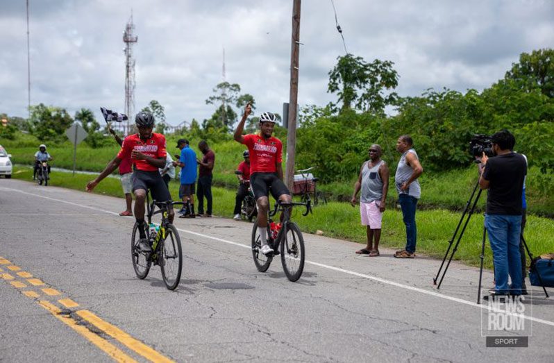 Akil Campbell (left) and Jamual John crossed the finish line together on Sunday (Photo: News Room/Avenash Ramzan/May 15, 2022)