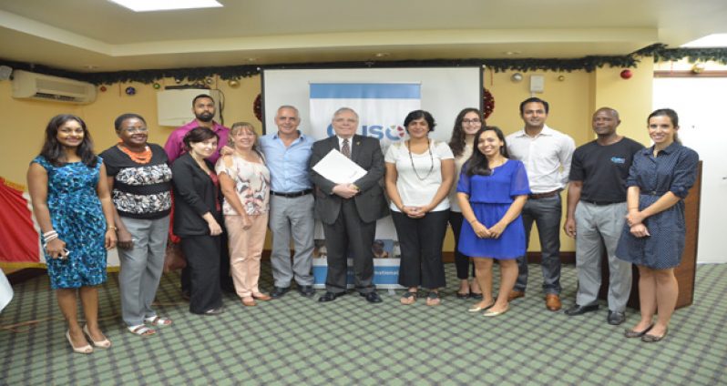 Canadian High Commissioner Pierre Giroux poses with members of the CUSO
International Volunteer Corps who will be working in Guyana on the VOICE Project