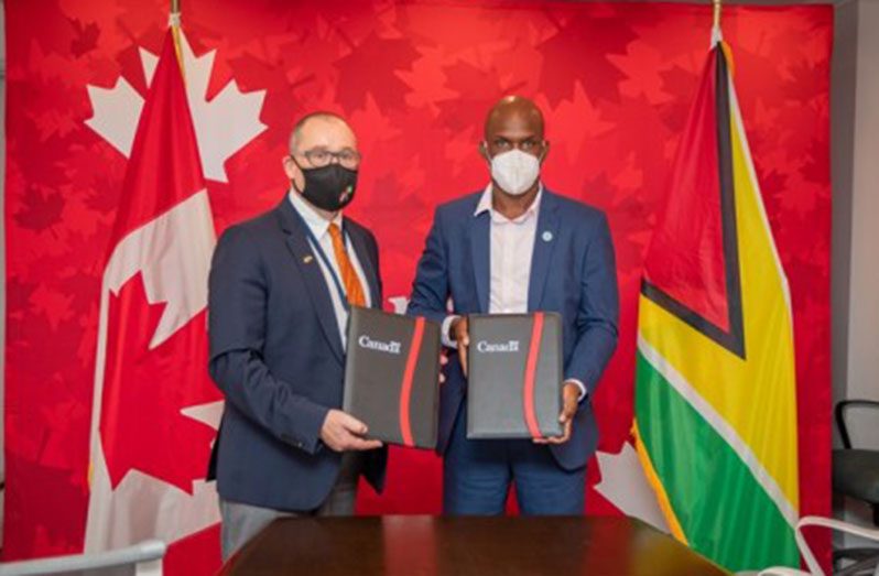 CDC Director-General, Lt. Col. Kester Craig and High Commissioner of Canada to Guyana, Mark Berman following the signing ceremony