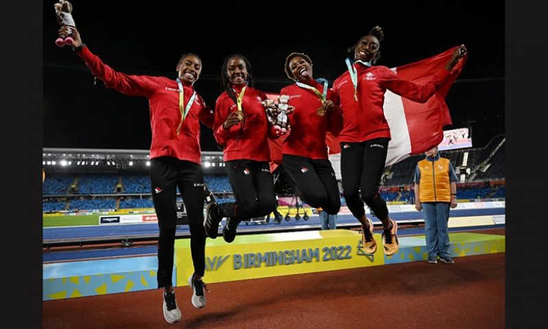 Commonwealth Games - Athletics - Women's 4 x 400m Relay - Medal Ceremony - Alexander Stadium, Birmingham, Britain -  Gold medallists Canada's Natassha Mcdonald, Aiyanna Stiverne. Micha Powell, Kyra Constantine celebrate on the podium REUTERS/Phil Noble
