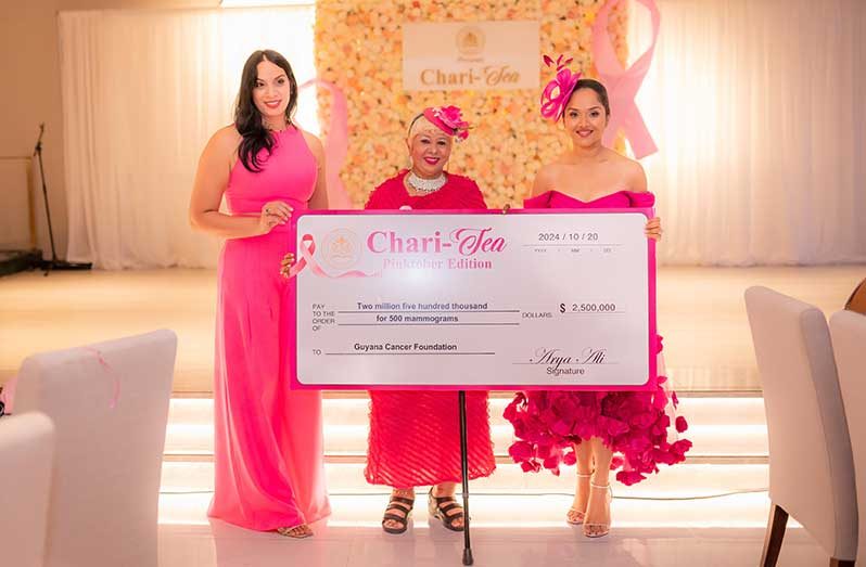 First Lady Mrs. Arya Ali, flanked by officials from the Guyana Cancer Society and the Guyana Cancer Foundation, delivers the ceremonial cheques with a total of $5M to sponsor 1,000 mammograms for women across Guyana