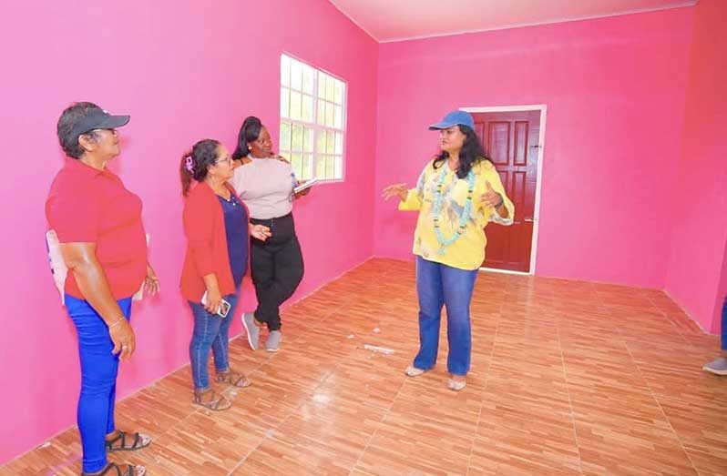Minister of Human Services and Social Security, Dr Vindhya Persaud engages with the Toshao, Wendy Francis and RDC councillor, Melrose Henry, at Capoey