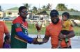 Sunil Ramlall (right) receives the winning trophy from Heimant Ram of Tourism Guyana