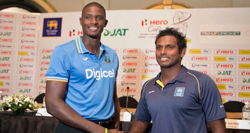 Jason Holder and Angelo Mathews pose ahead of the Test series in Colombo on Tuesday.