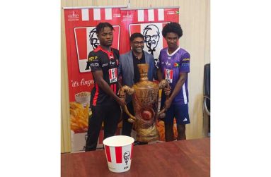 KFC Guyana's CEO, Paul Subryan, along with the captains of the two finalists