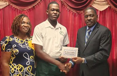 Former student of Anna Regina Multilateral School, Dr. Kurt Clarke
donated a monetary prize to one of the country’s top CSEC students,
Daniel Dowding. In the photo, Dr Clarke’s