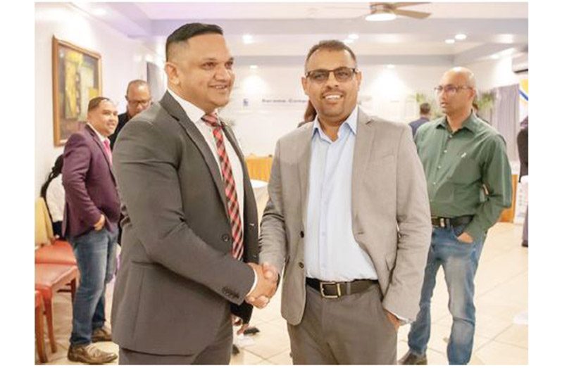 Country General Manager of the Barama
Company, Mohindra Chand with Minister of
Natural Resources Vickram Bharrat