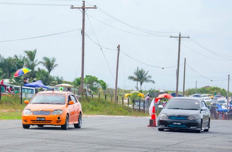 Marlon Wilson and Rayon Brijpal race to the finish line. (Samuel Maughn photo)