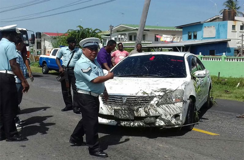 The heavily tinted car following the accident. [Delano Williams photo]