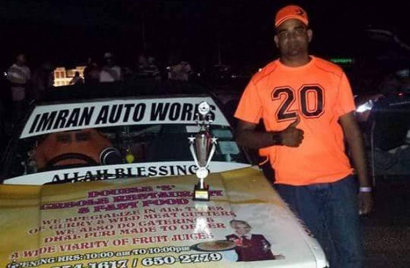 Imran Khan poses with his 13 second Champion trophy after the last drag race meet.