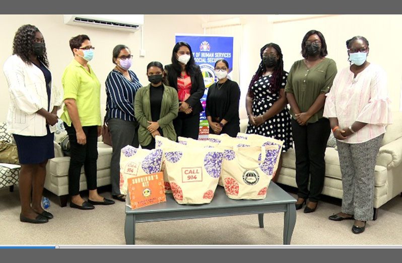 Minister of Human Services and Social Security, Dr. Vindhya Persaud, alongside survivors’ advocates with ‘Survivors’ Kit’ (DPI photo)