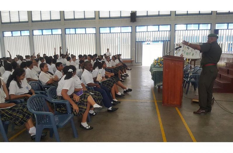 Major Earl Edghill addressing the students of Marian Academy.