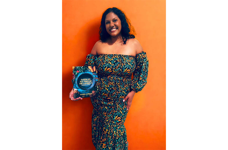 Saleisha Averhart with her new cookbook, Tasting My Way Through the Caribbean