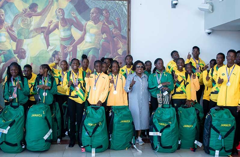 Jamaica Sports Minister Olivia Grange (c) greets the Carifta team on arrival in Kingston on Tuesday. Photo: MCGESjamaica