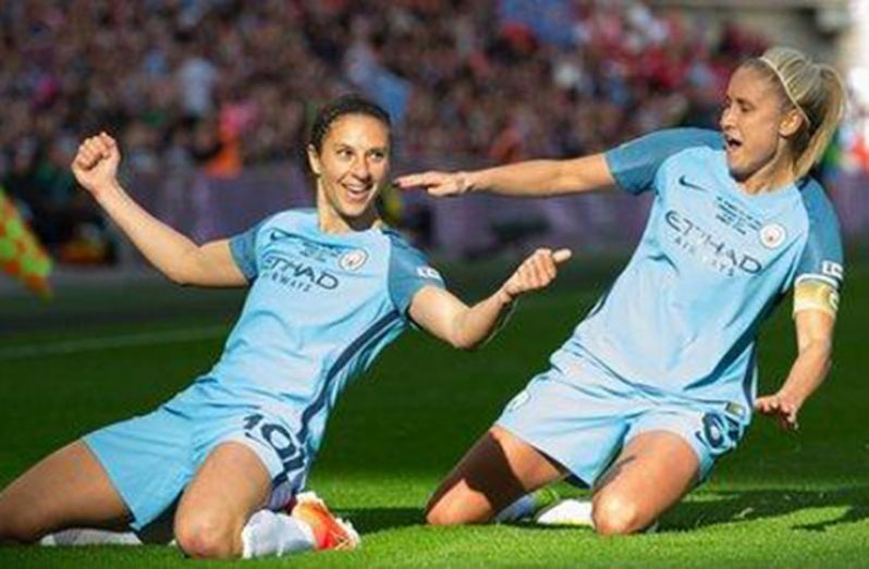 Carli Lloyd (left) headed Manchester City 3-0 ahead inside the opening 32 minutes at Wembley