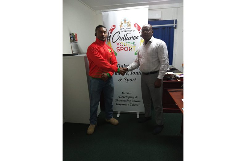 GAPLF president, Franklin Wilson, extending best wishes to Carlos Petterson-Griffith.