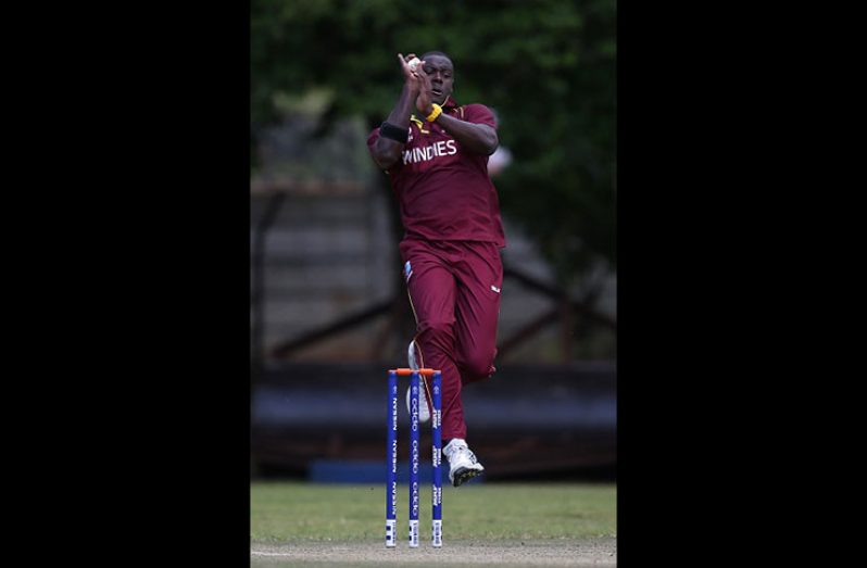 Seamer Carlos Brathwaite prepares to send down a delivery during his five-wicket haul against PNG yesterday. (Photo courtesy ICC)