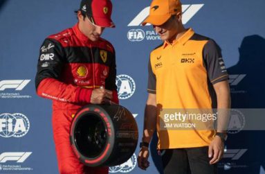 Ferrari's Spanish driver Carlos Sainz Jr (L) holds the Pole Position trophy with McLaren's Spanish test driver Alex Palou (R) after the qualifying session for the Formula One United States Grand Prix, at the Circuit of the Americas in Austin, Texas, yesterday