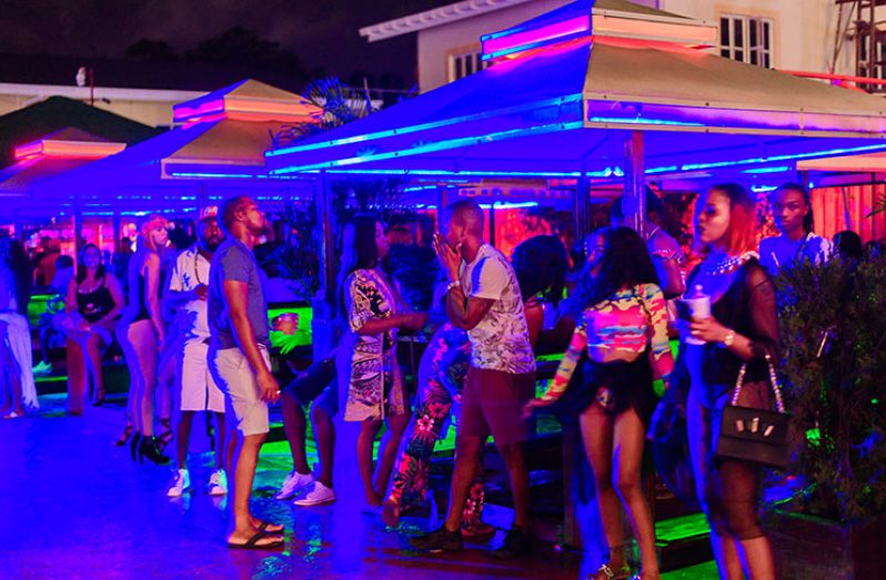 Some of the exotic colours and lighting that people 'feted' under at Bare Skinz at the Tower poolside (Delano Williams photos)
