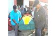 Family members carry the coffin from the National Gymnasium  