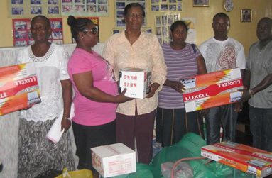 Ms Carter (fourth, right) enjoys being of assistance to the needy.