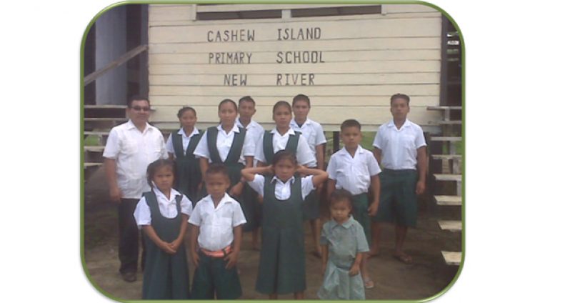 Major (ret’d) Ivan Mc Naughton (left) with some of his charges at Cashew Island Primary, in New River
