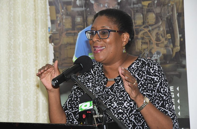 Minister of Public Telecommunications Catherine Hughes