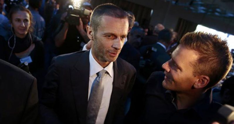 Newly elected UEFA president Aleksander Ceferin of Slovenia is congratulated after the election during the UEFA Extraordinary Congress in Athens, Greece yesterday. (REUTERS/Alkis Konstantinidis)